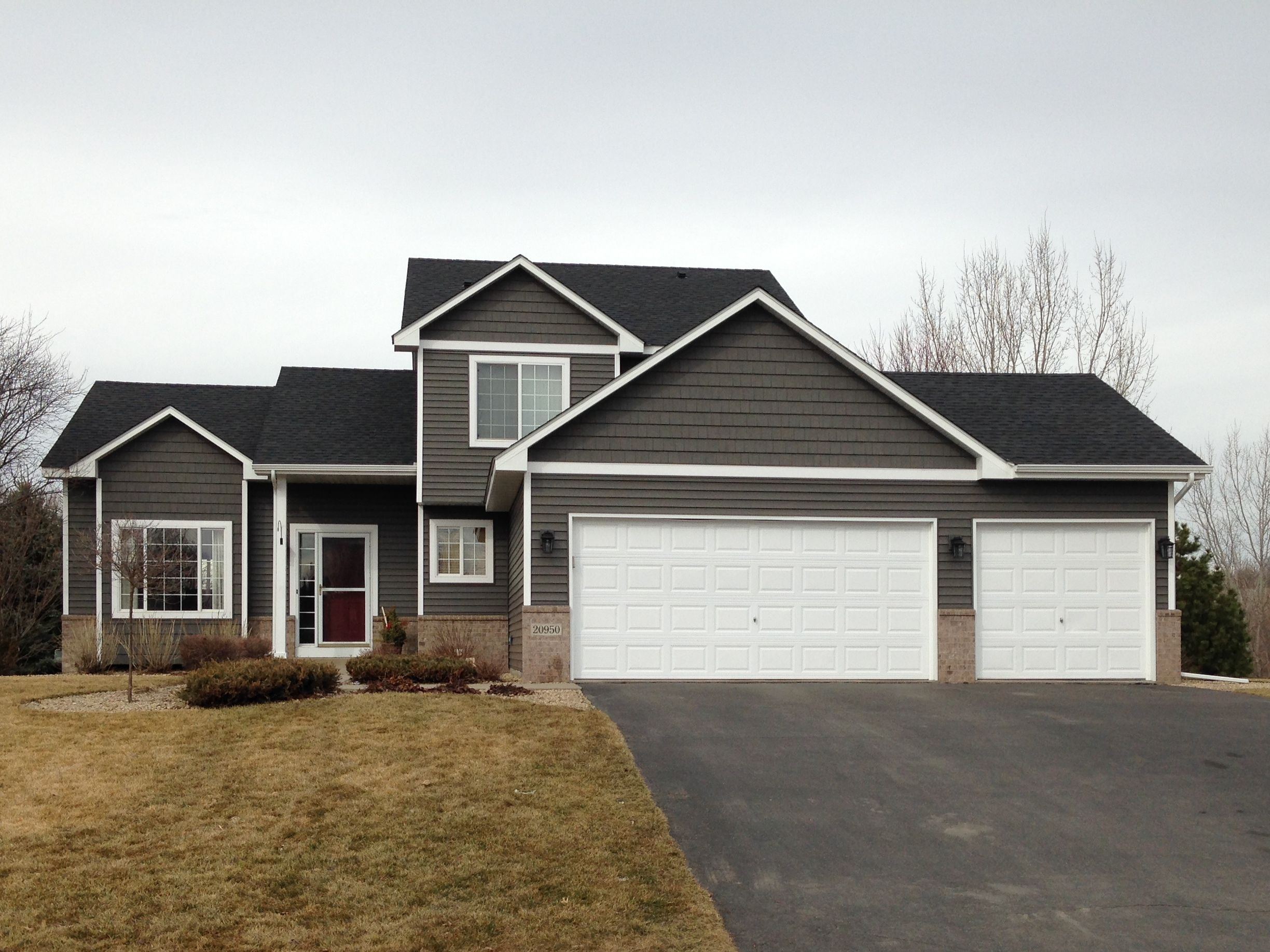 Two-story home with new Siding, trim, and a fresh shingle roof